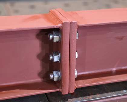 A real bolted end-plate splice joint on a painted steel beam